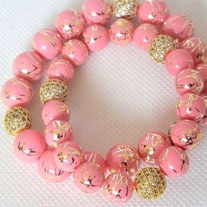 Pink beaded bracelet 💗 with gold spacer